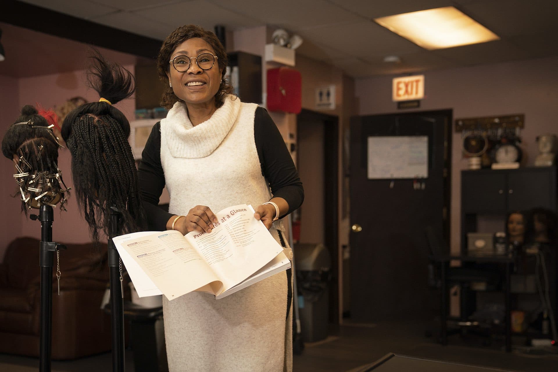 Yolande Sanvi holding curriculum materials