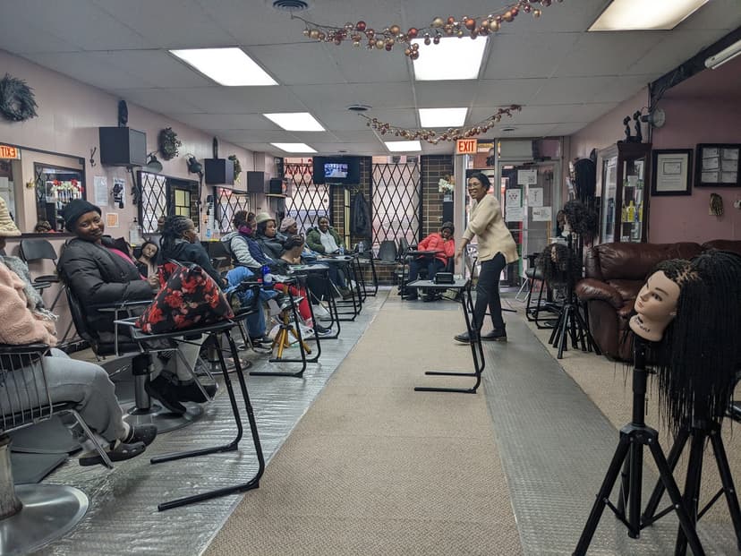 LYS instructor teaching hair braiding class